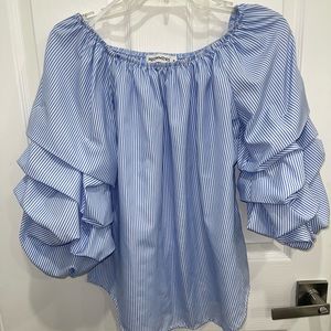 Striped blue and white blouse.